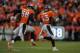 DENVER, CO - JANUARY 24: Von Miller #58 and T.J. Ward #43 of the Denver Broncos run off the field and celebrate after the New England Patriots turned the ball over on downs in the AFC Championship game at Sports Authority Field at Mile High on January 24, 2016 in Denver, Colorado. (Photo by Dustin Bradford/Getty Images)