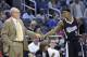 Sacramento Kings head coach George Karl, left, and guard Rajon Rondo (9) share a fist-bump during the second half of an NBA basketball game against the Orlando Magic in Orlando, Fla., Saturday, Nov. 21, 2015. The Kings won 97-91. (AP Photo/Phelan M. Ebenhack)