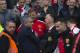 Chelsea's manager Jose Mourinho, left, greets Manchester United manager Louis van Gaal, center right, before the English Premier League soccer match between Manchester United and Chelsea at Old Trafford Stadium, Manchester, England, Sunday Oct. 26, 2014. (AP Photo/Jon Super)