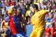 Barcelona's Luis Suarez, right, duels for the ball with Levante's David Navarro, during a Spanish La Liga soccer match between Levante and Barcelona, at the Ciutat de Valencia stadium in Valencia, Spain, Sunday, Feb. 7, 2016. (AP Photo/Alberto Saiz)