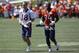 Denver Broncos quarterback Peyton Manning (18) and Denver Broncos defensive end DeMarcus Ware (94) run in from practice at the team's NFL football training camp Friday, July 31, 2015, in Englewood, Colo. (AP Photo/David Zalubowski)