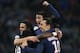 MARSEILLE - FEBRUARY 7: Angel Di Maria of PSG celebrates with Edinson Cavani (left) and Zlatan Ibrahimovic (right) scoring the second and winning goal for Paris during the French Ligue 1 match between Olympique de Marseille (OM) and Paris Saint-Germain (PSG) at New Stade Velodrome on February 7, 2016 in Marseille, France. (Photo by Jean Catuffe/Getty Images)