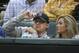 In this file photo made Tuesday, April 14, 2015, Johnny Manziel, left, sits with Colleen Crowley during a baseball game between the Los Angeles Angels and the Texas Rangers in Arlington, Texas. Dallas police announced Friday, Feb. 5, 2016, they were launching a criminal investigation into a domestic violence assault complaint filed against Manziel, who was involved in an altercation last weekend during which he allegedly struck his ex-girlfriend, Colleen Crowley, several times. (AP Photo/LM Otero)