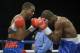 CINCINNATI, OHIO - OCTOBER 3: Jamel Herring, left, swings at Yakubu Amidu during a fight at U.S. Bank Arena on October 3, 2015 in Cincinnati, Ohio. (Photo by Dylan Buell/Getty Images)