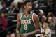 Milwaukee Bucks center Larry Sanders takes court against the Denver Nuggets in the fourth quarter of the Nuggets' 110-100 victory in an NBA basketball game in Denver on Wednesday, Feb. 5, 2014. (AP Photo/David Zalubowski)