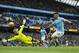 Manchester City's Sergio Aguero, right, shoots wide past Leicester City's goalkeeper Kasper Schmeichel during the English Premier League soccer match between Manchester City and Leicester City at the Etihad Stadium in Manchester, England, Saturday Feb. 6, 2016. (AP Photo/Jon Super)