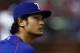 ARLINGTON, TX - AUGUST 26: Yu Darvish #11 of the Texas Rangers looks on as the Rangers take on the Toronto Blue Jays in the bottom of the fourth inning at Globe Life Park in Arlington on August 26, 2015 in Arlington, Texas. (Photo by Tom Pennington/Getty Images)