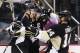 Pittsburgh Penguins' Sidney Crosby, center, celebrates his goal with teammates Patric Hornqvist, left, and Chris Kunitz (14) during the second period of an NHL hockey game against the Anaheim Ducks in Pittsburgh, Monday, Feb. 8, 2016. (AP Photo/Gene J. Puskar)