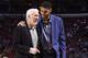 PHILADELPHIA - DECEMBER 07: Gregg Popovich and Tim Duncan #21 of the San Antonio Spurs smile and talk during the game against the Philadelphia 76ers at the Wells Fargo Center on December 7, 2015 in Philadelphia, Pennsylvania. NOTE TO USER: User expressly acknowledges and agrees that, by downloading and or using this photograph, User is consenting to the terms and conditions of the Getty Images License Agreement. Mandatory Copyright Notice: Copyright 2015 NBAE (Photo by David Dow/NBAE via Getty Images)