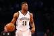 Dec 12, 2015; Brooklyn, NY, USA; Brooklyn Nets forward Thaddeus Young (30) advances the ball during the first quarter against the Los Angeles Clippers at Barclays Center. Mandatory Credit: Anthony Gruppuso-USA TODAY Sports