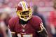 Washington Redskins wide receiver Josh Morgan carries the ball during warm ups before an NFL preseason football game against the Pittsburgh Steelers, Monday, Aug. 19, 2013, in Landover, Md. (AP Photo/Nick Wass)