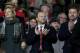 Manchester United chief executive Ed Woodward, centre, applauds before the team's English Premier League soccer match against Tottenham at Old Trafford Stadium, Manchester, England, Wednesday Jan. 1, 2014. (AP Photo/Jon Super)