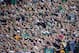 The student section at Notre Dame Stadium wave their arms during the second half of an NCAA college football game against Navy, Saturday, Oct. 10, 2015, in South Bend, Ind. Notre Dame won the game 41-24. (AP Photo/Jeff Haynes)