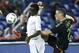 Mexico's Jesus Duenas (20) and Senegal's Elimane Oumar Cisse (6) battle for the ball during the first half of a soccer match at Marlins Park, Wednesday, Feb. 10, 2016, in Miami. (AP Photo/Wilfredo Lee)