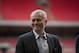 Former Chelsea manager Jose Mourinho smiles as he attends a group photo session pitchside as a guest of FIFA Presidential Candidate Gianni Infantino after unveiling his 90 day plan that he will implement if he is elected FIFA President, at Wembley Stadium in London, Monday, Feb. 1, 2016. (AP Photo/Matt Dunham)