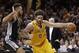 Cleveland Cavaliers' Kevin Love (0) drives past San Antonio Spurs' Kyle Anderson (1) in the first half of an NBA basketball game Saturday, Jan. 30, 2016, in Cleveland. (AP Photo/Tony Dejak)