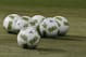Soccer balls are shown during warmups before the start of a soccer match between Senegal and Mexico at Marlins Park, Wednesday, Feb. 10, 2016, in Miami. (AP Photo/Wilfredo Lee)