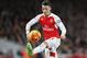 Arsenal's Mesut Ozil stops the ball during the English Premier League soccer match between Arsenal and Southampton at the Emirates stadium in London, Tuesday, Feb. 2, 2016. (AP Photo/Frank Augstein)
