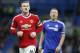 Manchester United's captain Wayne Rooney, and Chelsea's John Terry during the English Premier League soccer match between Chelsea and Manchester United at Stamford Bridge stadium in London, Sunday, Feb. 7, 2016. (AP Photo/Frank Augstein)