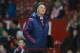 Manchester United's manager Louis van Gaal looks at the sky as hail begins to fall after his team's 3-0 win in the English Premier League soccer match between Manchester United and Stoke at Old Trafford Stadium, Manchester, England, Tuesday, Feb. 2, 2016. (AP Photo/Jon Super)