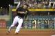 Pittsburgh Pirates' Jung Ho Kang bats against the Milwaukee Brewers during a game, Friday, Sept. 11, 2015, in Pittsburgh. (AP Photo/Fred Vuich)