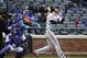 New York Mets catcher Travis d'Arnaud (7) and Washington Nationals' Bryce Harper (34) watch Harper's two-run home run in the eighth inning of the first baseball game of a doubleheader, Saturday, Oct. 3, 2015, in New York. The Nationals won 3-1. (AP Photo/Kathy Kmonicek)