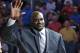 Former NBA basketball player Shaquille O'Neal waves to fans as he is honored during an NBA basketball game between the Orlando Magic and the Detroit Pistons after he was inducted in the Magic Hall of Fame, Friday, March 27, 2015, in Orlando, Fla. Selected by Orlando with the first overall pick of the 1992 NBA Draft, O'Neal spent four seasons with the Magic from 1992-96. (AP Photo/John Raoux)