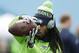 Seattle Seahawks cornerback Richard Sherman warms up before the first half of an NFL divisional playoff football game between the Carolina Panthers and the Seattle Seahawks, Sunday, Jan. 17, 2016, in Charlotte, N.C. (AP Photo/Bob Leverone)