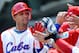 MEXICO CITY - MARCH 08: Yulieski Gourriel #10 of Cuba is congratulated by his teammates after hitting a home run against South Africa during the 2009 World Baseball Classic Pool B match on March 8, 2009 at the Estadio Foro Sol in Mexico City, Mexico. (Photo by Kevork Djansezian/Getty Images)