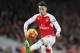 Arsenal's Mesut Ozil stops the ball during the English Premier League soccer match between Arsenal and Southampton at the Emirates stadium in London, Tuesday, Feb. 2, 2016. (AP Photo/Frank Augstein)