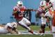 Louisiana Tech running back Kenneth Dixon (28) beats a tackle against Illinois defensive lineman Austin Teitsma (44) and finds a hole to run as Louisiana Tech Kirby Wixson (73) blocks Illinois Mason Monheim (43) during the first half of the Heart of Dallas Bowl NCAA college football game Friday, Dec. 26, 2014, in Dallas. (AP Photo/LM Otero)