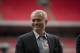 Former Chelsea manager Jose Mourinho smiles as he attends a group photo session pitchside as a guest of FIFA Presidential Candidate Gianni Infantino after unveiling his 90 day plan that he will implement if he is elected FIFA President, at Wembley Stadium in London, Monday, Feb. 1, 2016. (AP Photo/Matt Dunham)