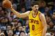 Cleveland Cavaliers' Kevin Love works on Boston Celtics' Amir Johnson during the second quarter of a NBA basketball game in Boston Tuesday, Dec. 15, 2015. (AP Photo/Winslow Townson)