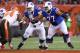 Buffalo Bills tackle Cordy Glenn (77) and Richie Incognito (64) against Cleveland Browns defensive tackle Randy Starks (94) in an NFL preseason football game, Thursday, Aug. 20, 2015, in Cleveland. (AP Photo/Ron Schwane)