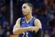 Minnesota Timberwolves' Kevin Martin adjusts an arm sleeve during the first half of an NBA basketball game against the Phoenix Suns Sunday, Dec. 13, 2015, in Phoenix. The Suns defeated the Timberwolves 108-101. (AP Photo/Ross D. Franklin)
