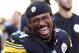 Pittsburgh Steelers running back DeAngelo Williams (34) celebrates with teammates on the sidelines after rushing for his third touchdown of the game during the second half of an NFL football game against the San Francisco 49ers in Pittsburgh, Sunday, Sept. 20, 2015. The Steelers won 43-18. (AP Photo/Gene J. Puskar)