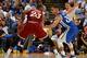OAKLAND, CA - DECEMBER 25: LeBron James #23 of the Cleveland Cavaliers dribbles the ball while defended by Stephen Curry #30 of the Golden State Warriors on December 25, 2015 at ORACLE Arena in Oakland, California. NOTE TO USER: User expressly acknowledges and agrees that, by downloading and or using this Photograph, user is consenting to the terms and conditions of the Getty Images License Agreement. Mandatory Copyright Notice: Copyright 2015 NBAE (Photo by Noah Graham/NBAE via Getty Images)
