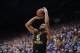 LAWRENCE, KS - FEBRUARY 9: Jaysean Paige #5 of the West Virginia Mountaineers shoots against the Kansas Jayhawks at Allen Fieldhouse on February 9, 2015 in Lawrence, Kansas. (Photo by Ed Zurga/Getty Images)