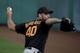 San Francisco Giants starting pitcher Madison Bumgarner throws during practice before the spring baseball season in Scottsdale, Ariz., Thursday, Feb. 18, 2016. (AP Photo/Chris Carlson)