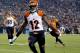 Cincinnati Bengals wide receiver Mohamed Sanu (12) scores a touchdown against the Denver Broncos during the first half of an NFL football game, Monday, Dec. 28, 2015, in Denver. (AP Photo/Jack Dempsey)