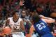 Illinois forward Leron Black (12) looks to pass while being guarded by Western Carolina forward Justin Browning (23) during an NCAA college basketball game in Champaign, Ill., Saturday, Dec. 5, 2015. (AP Photo/Robin Scholz)