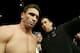 John McCarthy guides Ken Shamrock into the arena to fight Tito Ortiz for the light heavyweight bout as part of the Ultimate Fighting Championship 61 in Las Vegas on Saturday, July 8, 2006. Ortiz defeated Ken Shamrock in the bout. (AP Photo/Jane Kalinowsky)