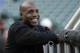 FILE - In this Aug. 25, 2015, file photo, former baseball player Barry Bonds smiles before a baseball game between the San Francisco Giants and the Chicago Cubs in San Francisco. Steroids-tainted home run king Barry Bonds is returning to baseball full time as hitting coach for the Miami Marlins. (AP Photo/Jeff Chiu, File)