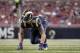 St. Louis Rams defensive end Chris Long takes up his position during the second quarter of an NFL preseason football game against the Indianapolis Colts Saturday, Aug. 29, 2015, in St. Louis. (AP Photo/Tom Gannam)