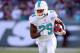 Miami Dolphins running back Lamar Miller (26) runs with the ball against the New York Jets during an NFL game at MetLife Stadium in East Rutherford, N.J. on Sunday, Nov. 29, 2015. (AP Photo/Brad Penner)