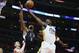 Golden State Warriors' Draymond Green, right, reaches for a rebound over Los Angeles Clippers' DeAndre Jordan, center, and Warriors' Klay Thompson, left, during the first half of an NBA basketball game Saturday, Feb. 20, 2016, in Los Angeles. (AP Photo/Danny Moloshok)