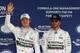 MEXICO CITY, MEXICO - OCTOBER 31: Nico Rosberg of Germany and Mercedes GP celebrates pole position as team mate and second place driver Lewis Hamilton of Great Britain and Mercedes GP
looks on after qualifying for the Formula One Grand Prix of Mexico at Autodromo Hermanos Rodriguez on October 31, 2015 in Mexico City, Mexico. (Photo by Clive Mason/Getty Images)