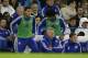 Chelsea's manager until the end of the season Guus Hiddink, center bottom, watches as substitutes Eden Hazard, left, and Loic Remy get up to warm up during the English Premier League soccer match between Chelsea and Watford at Stamford Bridge stadium in London, Saturday, Dec. 26, 2015. (AP Photo/Matt Dunham)
