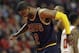 FILE - In this May 14, 2015, file photo, Cleveland Cavaliers guard Kyrie Irving (2) grimaces during the first half of Game 6 against the Chicago Bulls in a second-round NBA basketball playoff series in Chicago. Kyrie Irving skipped the morning shootaround Friday, May 22, 2015, before Game 2 of the Eastern Conference final to get further evaluation on his ailing left knee. (AP Photo/Nam Y. Huh, File)