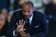 Former French international Thierry Henry waves during a men's singles semi-final match between Switzerland's Roger Federer and Switzerland's Stan Wawrinka on day seven of the ATP World Tour Finals tennis tournament in London on November 21, 2015.
/ AFP / GLYN KIRK (Photo credit should read GLYN KIRK/AFP/Getty Images)